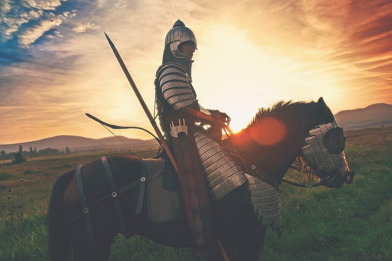 Man wearing armor on horse